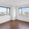 San Francisco, CA Luxury Apartments for Rent - Trinity Place at 1190 - Unfurnished Living Space with Wood-Style Flooring, White Walls, and City Views