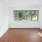 1 BR Apartments in San Francisco CA - Trinity Place at 1190 - Empty Bedroom wtih White Walls, Wood-Style Flooring, and Large Windows