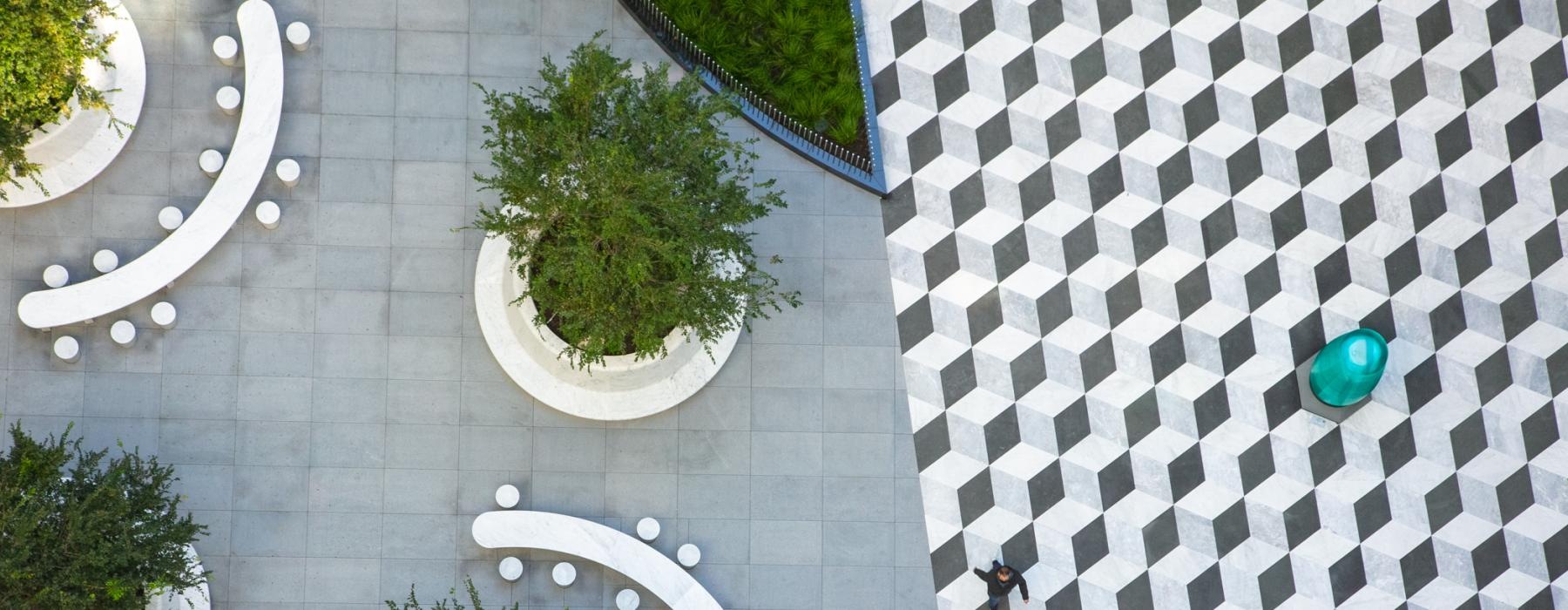 a courtyard with plants and a fountain